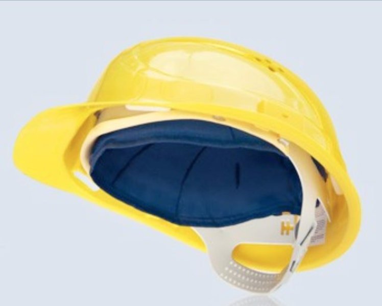 Das Bild zeigt einen gelben Schutzhelm leicht von unten, so dass ein schwarzes Inlay im Helm zu sehen ist, das den Kopf rundum kühlt.