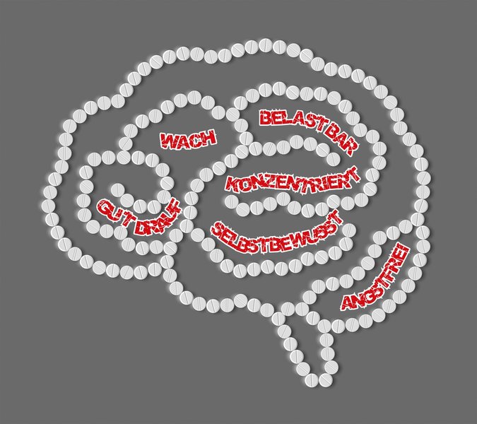 Das Bild zeigt ein mit weißen Pillen geformtes Gehirn, in dem rote Begriffe zu erwünschten Wirkungen von Medikamenten stehen.