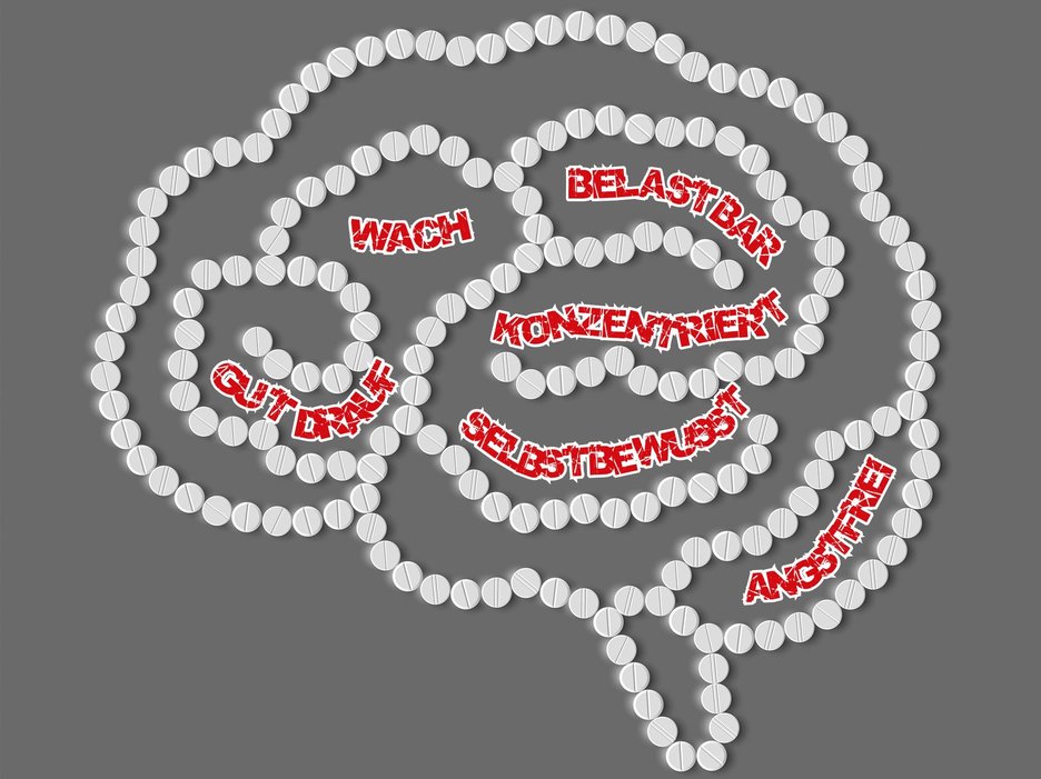 Das Bild zeigt ein mit weißen Pillen geformtes Gehirn, in dem rote Begriffe zu erwünschten Wirkungen von Medikamenten stehen. Link zur vergrößerten Darstellung des Bildes.