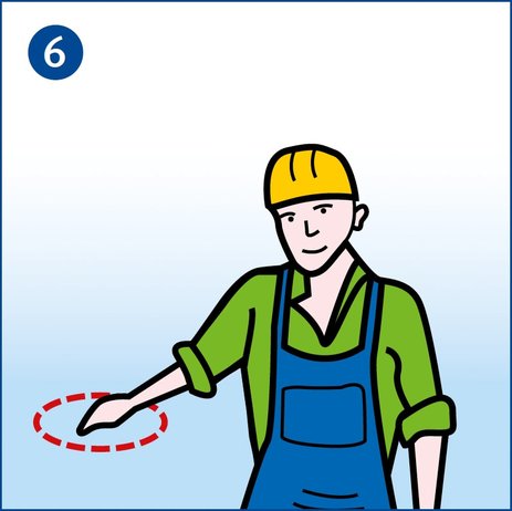 Zu sehen ist ein Arbeiter, der seinen rechten Arm schräg nach unten hält und dort mit der Hand eine kreisende Bewegung ausführt. Das ist das Handzeichen bei Kranarbeiten für „Senken, ab“. Link zur vergrößerten Darstellung des Bildes.